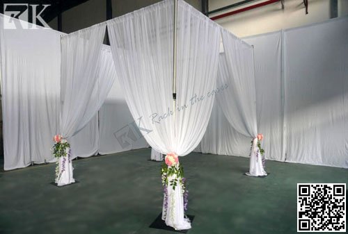 pipe and drape as backdrop for wedding