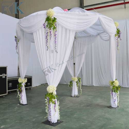 pipe and drape as backdrop curtain for wedding tent